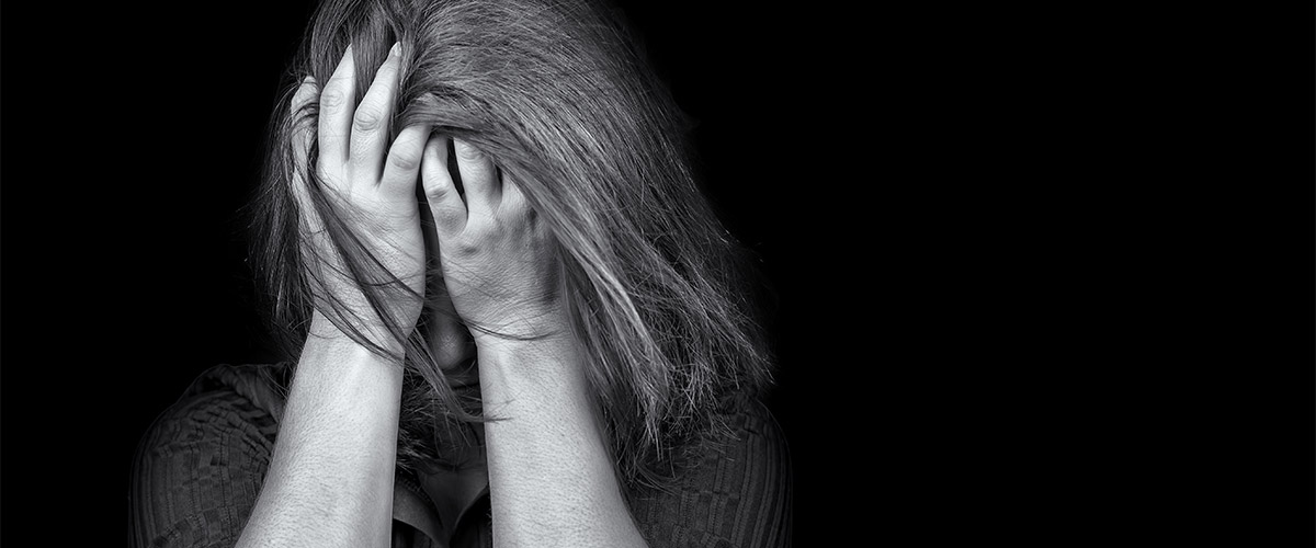 Young woman crying depression violence